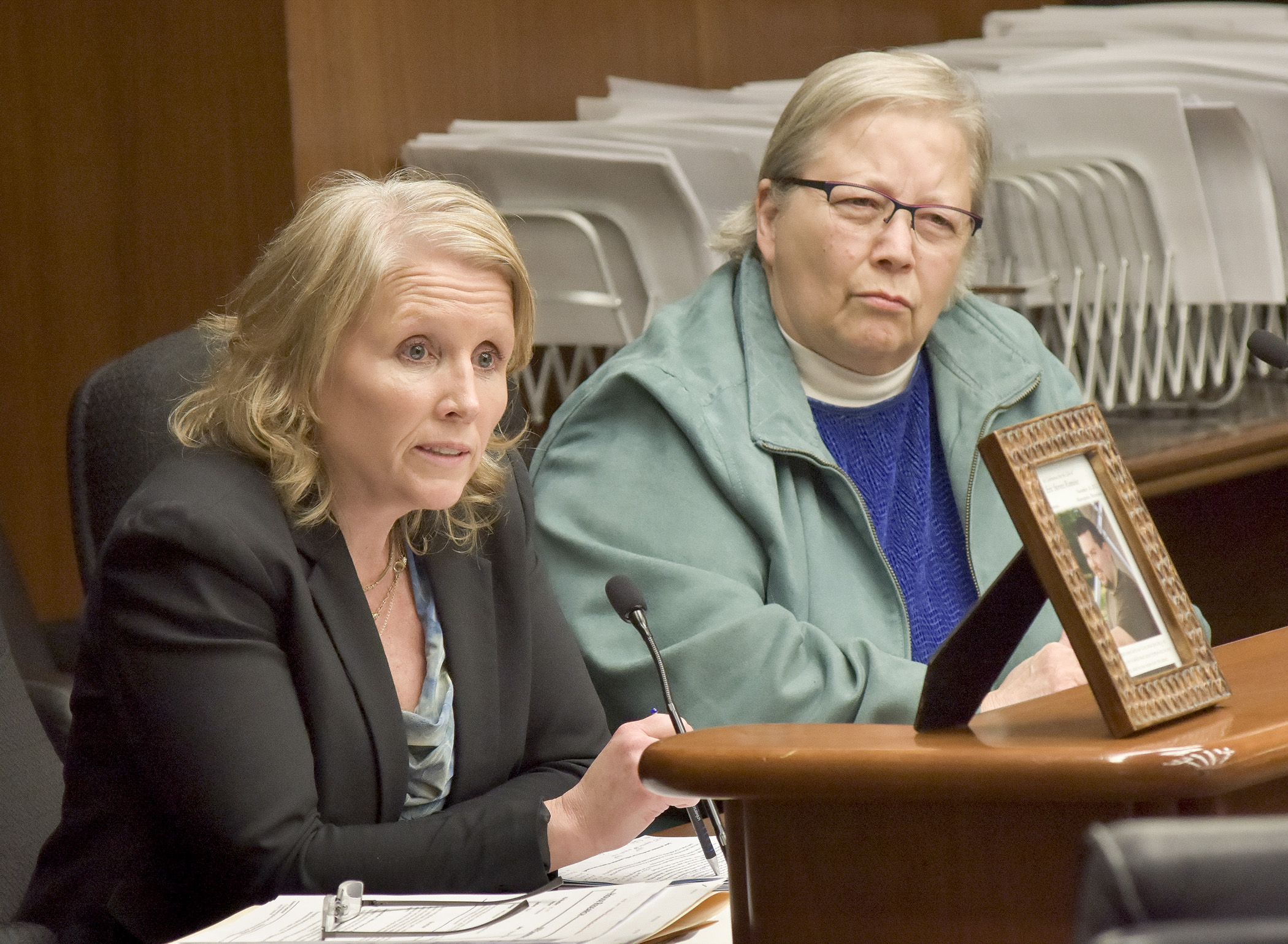 Rochelle Peterson, left, executive director of PACT for Families Collaborative, and parent Becky Romoz testify March 9 before the House Health and Human Services Finance Committee in support of HF1177, that would provide children’s mental health collaborative funding. Photo by Andrew VonBank